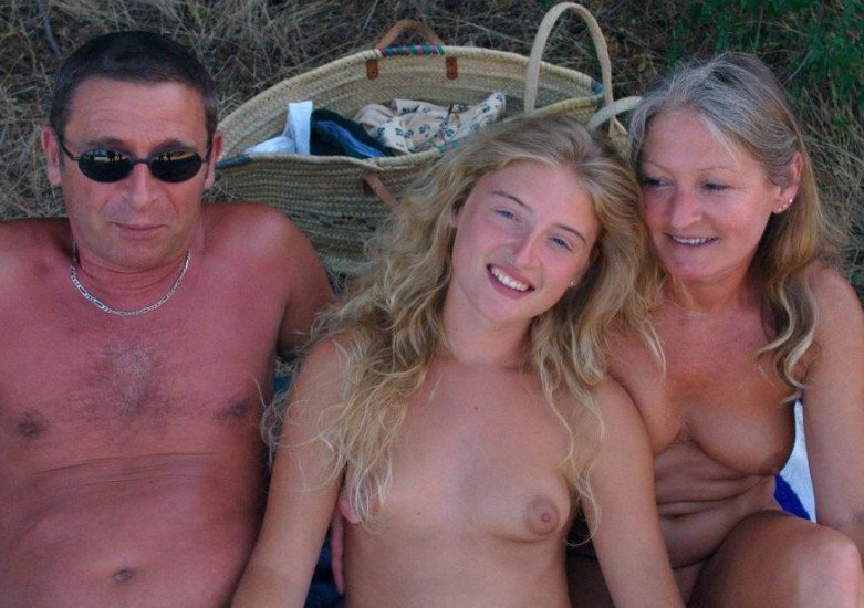 Family nudists, nude family on the beach