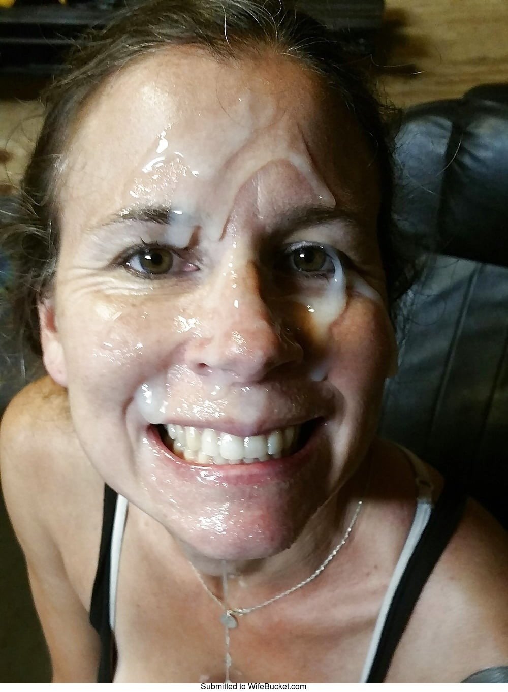 Cumming on wife face